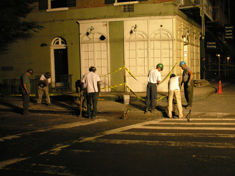 Workmen get ready to shore up the facade